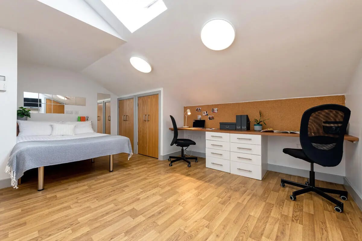 Bed desk chairs cabinets closet study area at Collegiate St James Street in Portsmouth Student Accommodation
