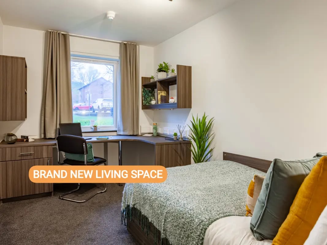 Desk chair bed plants modern living space at Foundry Court in Preston Student Accommodation