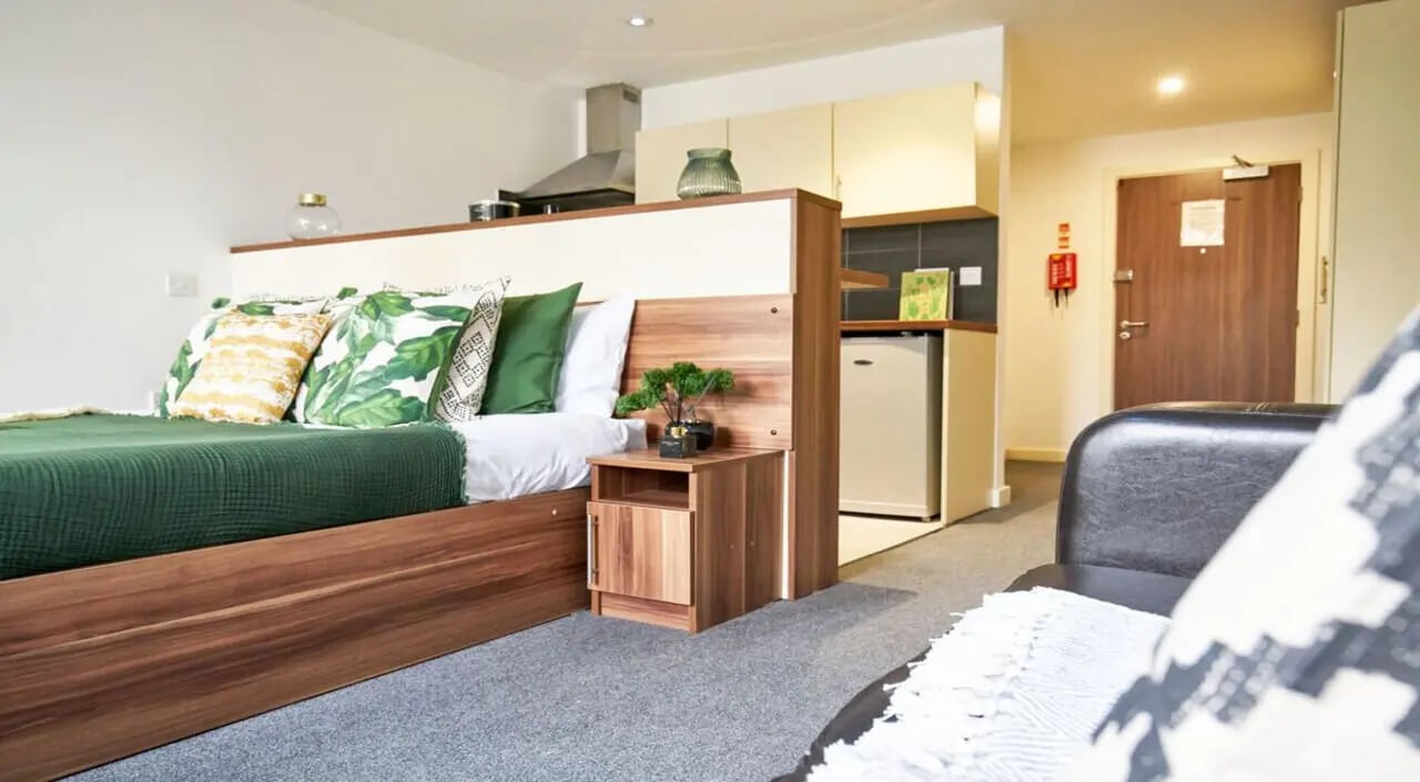 Bed side table mini fridge kitchen living area bedroom at Windsor Court in Liverpool Student Accommodation