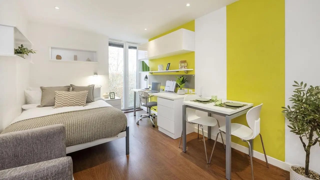 Bed desk dining area and chair study area at Griffon Studios in London Student Accommodation