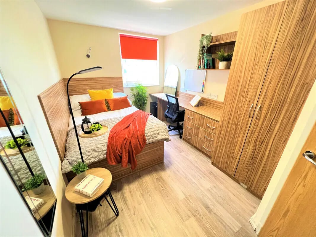 Bed desk wardrobe and mirror bedroom at Falkland House in Liverpool Student Accommodation
