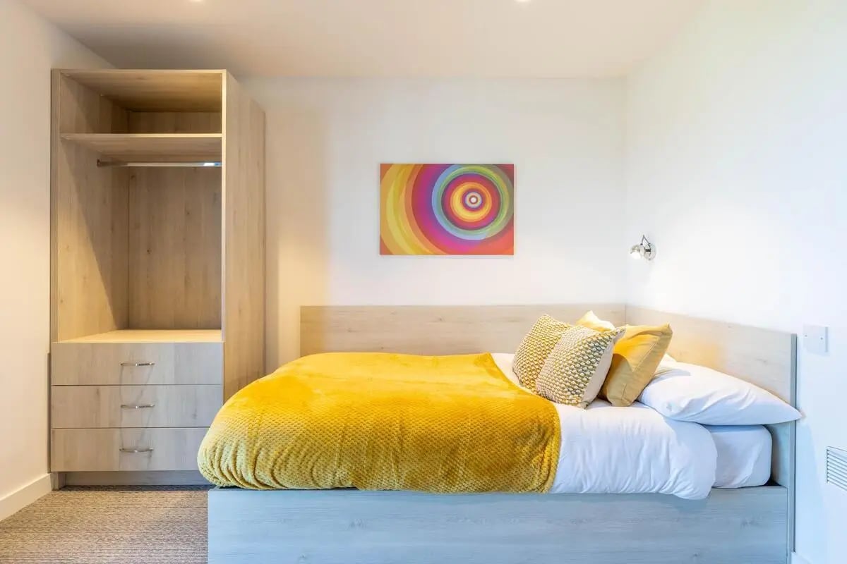 Bed wardrobe colorful art bright bedroom at Abeleven in Aberdeen Student Accommodation
