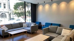 Sofa tables and blue chairs communal living room at UniLodge Ultimo in Sydney Student Accommodation