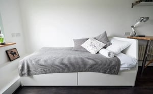 Daybed with drawers pillows and desk Bedroom at The Stay Club - Camden in London Student Accommodation