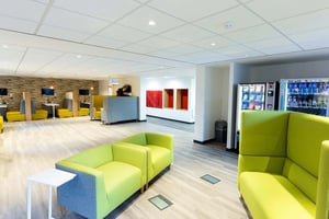 Modern lounge with booths vending machines and sofas lounge at Abbey House in Coventry Student Accommodation