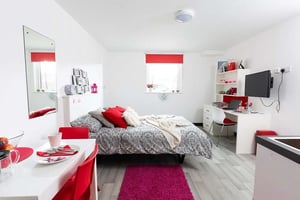 Bed desk mirror and dining area bedroom at Julian Court in Coventry Student Accommodation