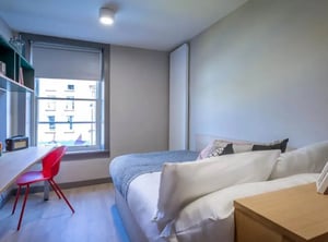 Bed desk red chair window shelf bedroom at Highlight Thomas Street in Dublin Student Accommodation