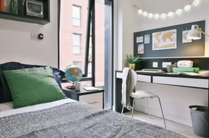 Bed desk globe and blanket study area at Maple House in Liverpool Student Accommodation