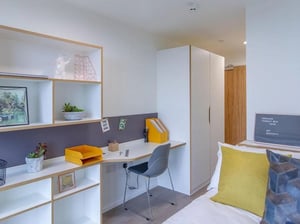 Desk shelves chair and closet bedroom at Bridge Street Exchange in Cardiff Student Accommodation