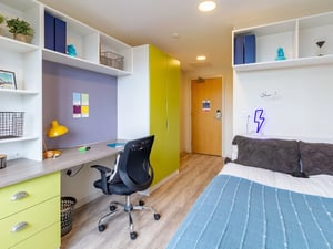 Desk chair lamp bed wardrobe study area bedroom at The Barn in Exeter Student Accommodation