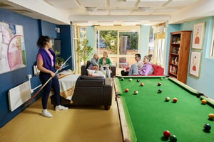 Pool table lounge with people and furniture living room at Boundary x Scape in Sydney Student Accommodation