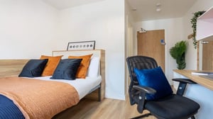 Desk laptop chair and bed bedroom at MSV South in Manchester Student Accommodation