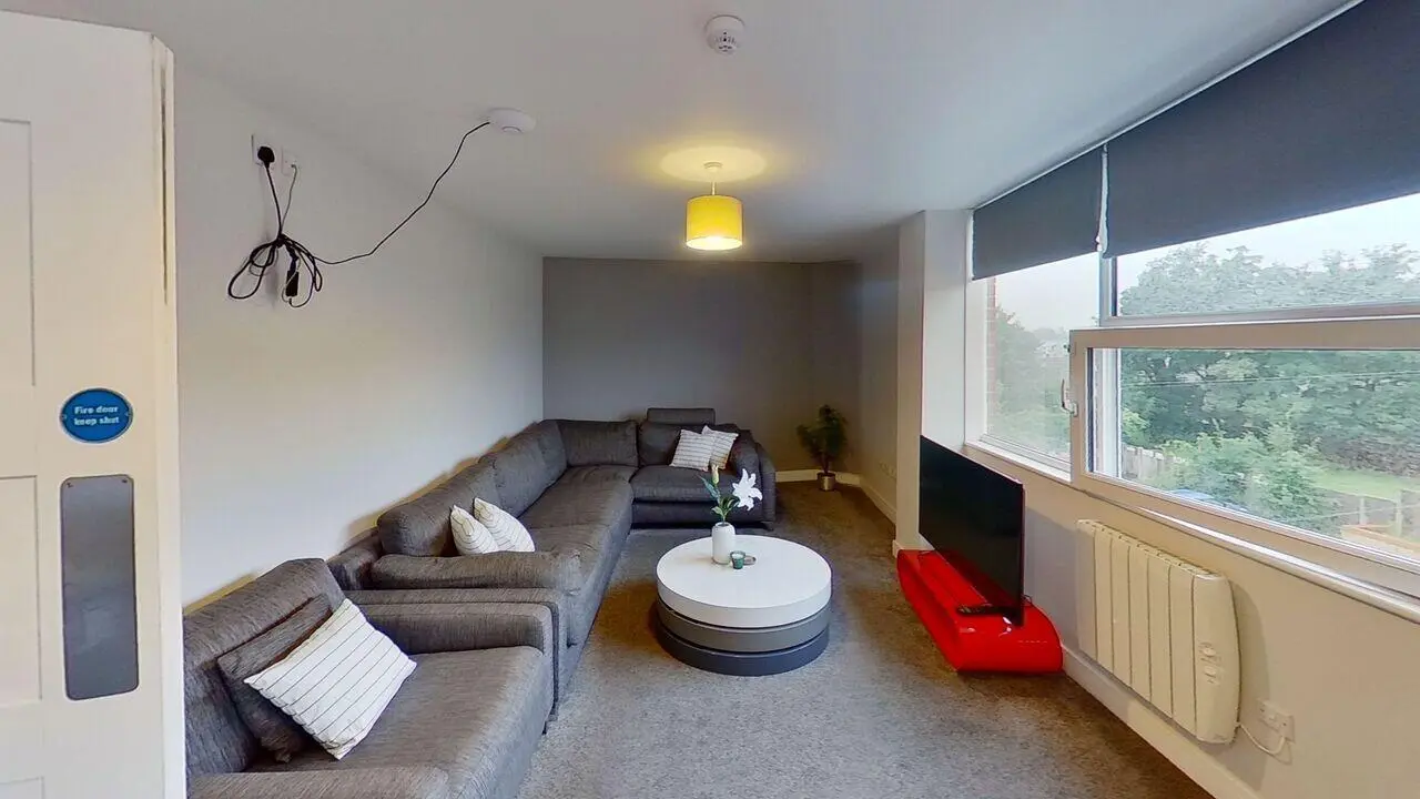 Gray sectional sofa white coffee table living room at Middle Street - Nottingham in Nottingham Student Accommodation
