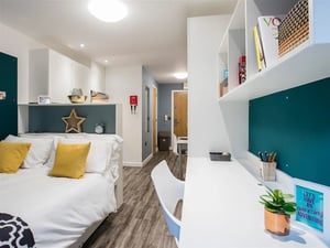 Bed desk and shelves student accommodation bedroom at Botanic Studios in Belfast Student Accommodation