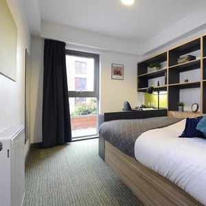 Bed desk shelves and window bedroom at Peel Park Quarter in Salford Student Accommodation