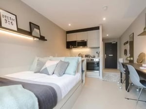 Bed kitchen and desk area studio apartment at Potterrow in Edinburgh Student Accommodation