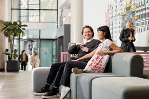 Sofa seating with students and art decor common area at Horizon Heights in Liverpool Student Accommodation