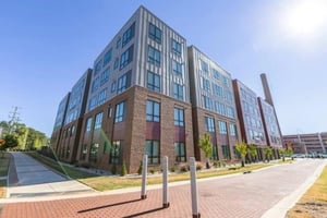 Modern brick and metal building with large windows exterior at The Nest At University Center in Rock Hill Student Accommodation