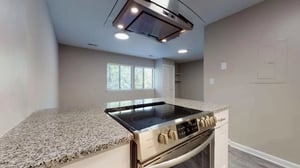 Granite countertop stainless steel stove kitchen at 3116 Hillsborough in Raleigh Student Accommodation