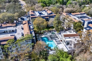 Apartment buildings surrounding pool and hot tub exterior at on50 Tampa Apartments in Tampa Student Accommodation