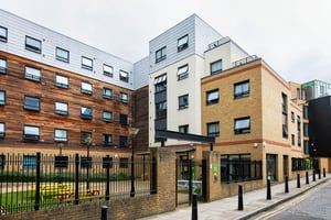 Modern student accommodation building with brick and wood exterior exterior at Pacific Court in London Student Accommodation