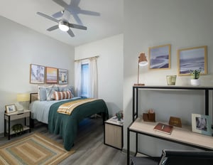 Bed with art desk with lamp bedroom at The Metropolitan Tallahassee in Tallahassee Student Accommodation