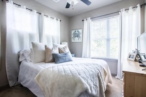 Bed with white bedding pillows and fuzzy blanket Bedroom at CollegePlace - Paces in Tallahassee Student Accommodation