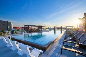 Pool lounge chairs and tables outdoor pool area at The Nine at Tallahassee in Tallahassee Student Accommodation