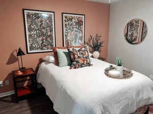 Bed with decorative pillows and framed art bedroom at Elevate on Cascade in Tallahassee Student Accommodation