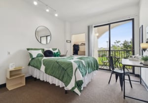 Bed desk and balcony bedroom at Malibu Apartments in Tampa Student Accommodation