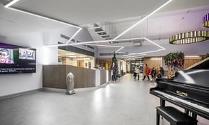 Reception desk with piano and screen lobby at Collegiate Eclipse in Cardiff Student Accommodation
