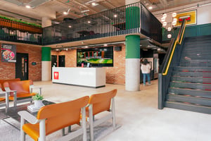 Reception area with modern furniture and stairs at Vita Student Station Street in Nottingham Student Accommodation
