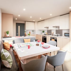 Monopoly board chairs and kitchen appliances kitchen at Avon Point in Bristol Student Accommodation