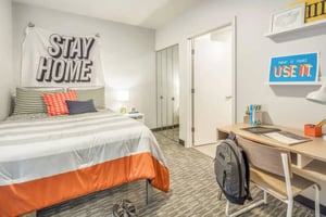 Bed desk and closet bedroom at Rise On 9th in Columbia Student Accommodation