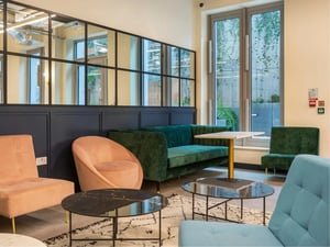 Velvet sofas armchairs tables lounge area at Great Court in London Student Accommodation