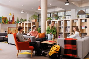 Students relaxing in a communal living space lounge at Salisbury court in Edinburgh Student Accommodation