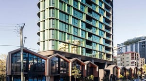 Modern apartments with green facades and gabled roofs exterior at Realm Kangaroo Point in Brisbane Student Accommodation