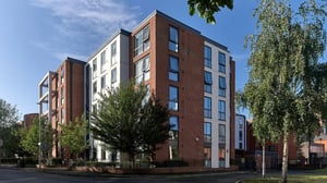 Modern brick and white student accommodation building exterior at Cavendish Place in Manchester Student Accommodation