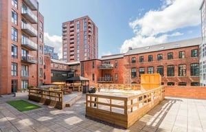 Courtyard with gazebo seating tables and balconies exterior at Cornerhouse in Sheffield Student Accommodation