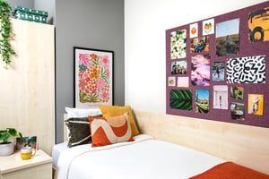 Bed with pillows artwork and photo board bedroom at Purbeck House in Bournemouth Student Accommodation