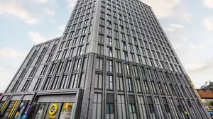 Studio apartment with kitchen desk and bed at Compass in Birmingham Student Accommodation