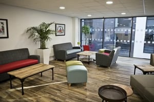 Sofas chairs tables plants communal area living room at Friargate Court in Preston Student Accommodation