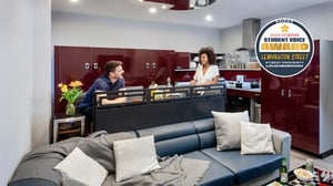Woman holding mug kitchen study area living room kitchen at Study Inn Loughborough - Lemyngton Street in Loughborough Student Accommodation