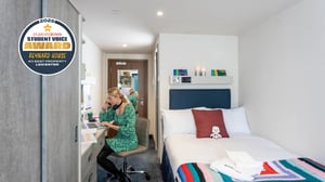 Student at desk and bed bedroom at Reynard House in Leicester Student Accommodation
