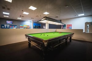 Pool table with balls and cues playing area at The Junxion Lincoln in Lincoln Student Accommodation