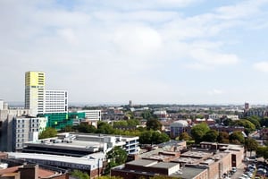 Tall yellow and white buildings with greenery exterior at Trafalgar Hall in Portsmouth Student Accommodation