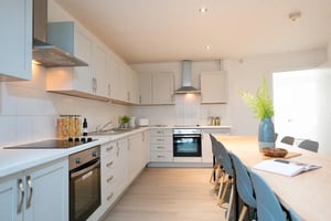 Modern kitchen with oven appliances and dining table kitchen at 1 Bedroom House at 328, Flat 2, Claremont Road in Manchester Student Accommodation