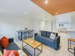 Sofas dining table chairs coffee table kitchen Living room at 6 Bedroom House at 3, Sage Road in Leicester Student Accommodation