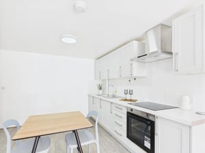 Wooden table and chairs kitchen area at 1 Bedroom House at Flat 16, Grove Street Studios, The Groves in Liverpool Student Accommodation