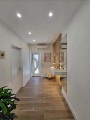 Hallway with mirrored vanity and plant entryway at Welcoming 2-bedroom apartment in Fundão in Fundão Student Accommodation